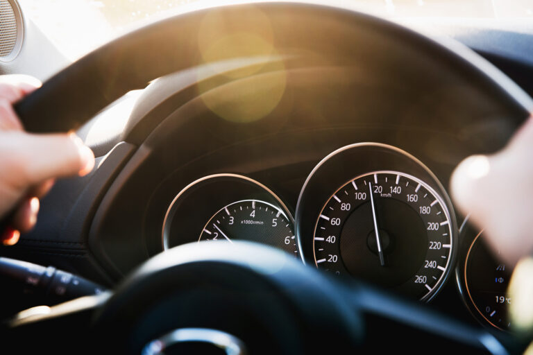 Speedometer Of A Car Close Up, With The Arrow Frozen At A Speed Of 120 Km/h. Details And Interior Of A Black Luxury Car.